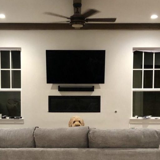 Flat-screen TV wall mount above fireplace in Highland Park, TX