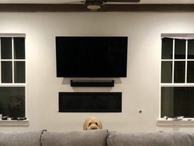 Flat-screen TV wall mount above fireplace in Highland Park, TX